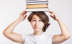 Schoolgirl with books on head © CollegeDegrees360 -- https://www.flickr.com/photos/83633410@N07/7658034524/in/photostream/ [Featured]