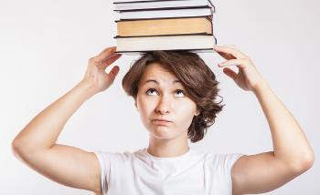 Schoolgirl with books on head © CollegeDegrees360 -- https://www.flickr.com/photos/83633410@N07/7658034524/in/photostream/ [Featured]